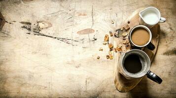 Coffee with milk on a wooden trunk. photo