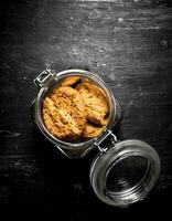 Oatmeal cookies in a jar. photo