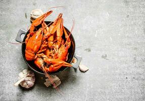 Boiled crawfish with garlic. photo