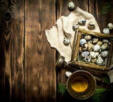 Quail eggs in basket and ground spices in a mortar. photo