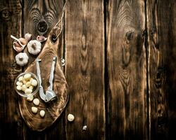 Garlic background . Fresh garlic on old wooden Board. photo