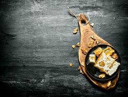 Honey background. Natural honey comb with walnut. photo