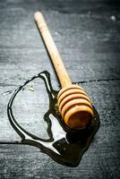 Wooden spoon of sweet natural honey. photo