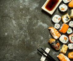 Sushi rolls with seafood and soy sauce. photo