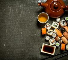 The rolls and sushi with herbal tea. photo