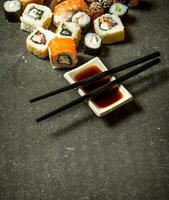 The rolls and sushi with soy sauce. photo