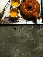 Fragrant tea brewed in a teapot. photo
