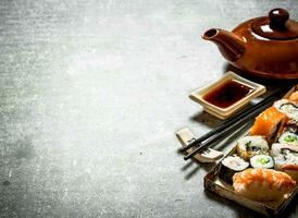 rolls , sushi and herbal tea photo