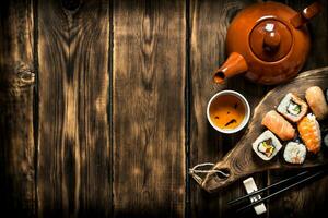 Sushi and rolls with herbal tea. photo