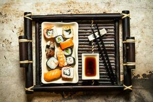 The rolls and sushi plate with soy sauce photo