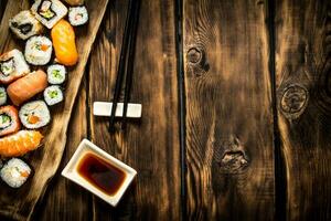 Sushi and rolls seafood with soy sauce. photo