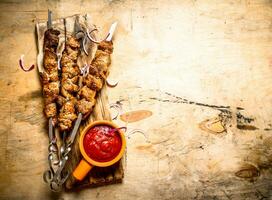 Shish kebab on skewers photo