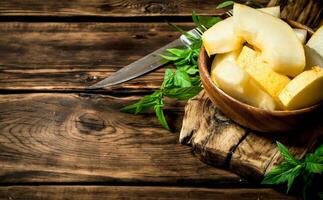 Slices of sweet melon with mint branches. photo