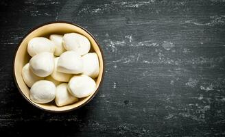 Fresh mozzarella in a bowl. photo