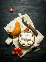 Mozzarella with fresh bread, tomatoes and greens. photo