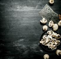 Fresh sliced mushrooms with the hatchet. photo