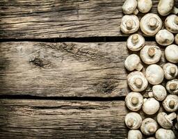 Fresh mushrooms . On wooden background. photo