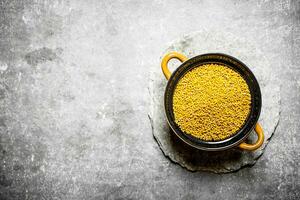 Mustard seeds in a bowl. photo