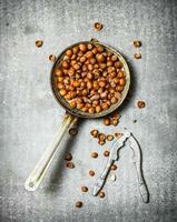 Hazelnuts and a Nutcracker in the old pan. photo