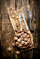 Walnuts with Nutcracker on the Board. photo