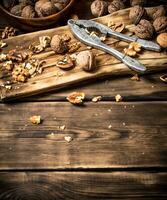 Walnuts with Nutcracker on the Board. photo