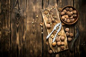 Walnuts with Nutcracker on the Board. photo