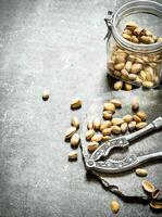 Pistachios in the jar with the Nutcracker. photo