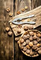 Walnuts with Nutcracker on the Board. photo