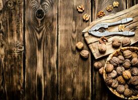 Walnuts with Nutcracker on the Board. photo