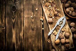 Walnuts with Nutcracker on the Board. photo