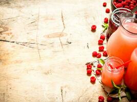 The juice of fresh raspberries and jam. photo
