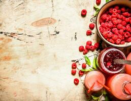 The juice of fresh raspberries and jam. photo