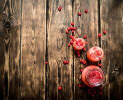 Raspberry juice in the pitcher. photo