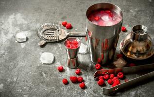 Summer cooling cocktail of wild raspberries with ice. photo