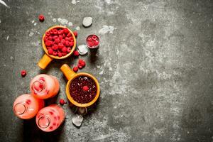 Fresh raspberry fruit drink with jam and ice. photo