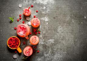 Raspberry juice with the berries and ice. photo