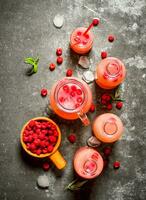 Raspberry juice with the berries and ice. photo