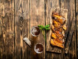 Barbecue ribs with a cold beer. photo