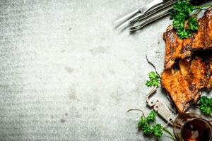 Smoked barbecue ribs with beer and herbs. photo