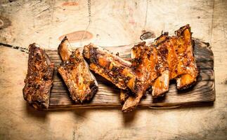 Pork ribs grilled on the old Board. photo