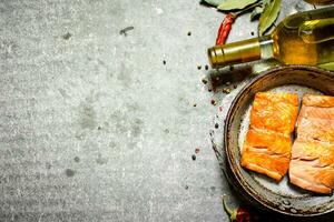 White wine with a grilled salmon fillet. photo