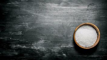 Salt in a wooden Cup. photo