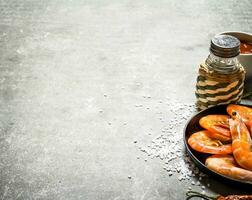 The shrimp in the pan with the sauce. photo