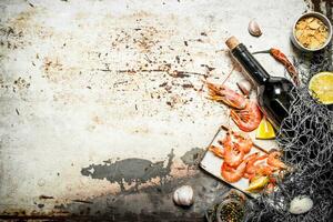 Wine with shrimp and spices photo