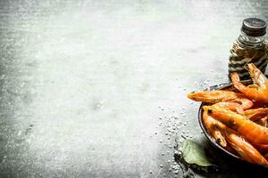 Shrimp with salt and Bay leaf. n the stone table. photo