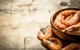 Raw shrimp in bowl. photo