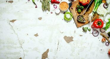 Organic food. Cutting Board with vegetables and herbs. photo