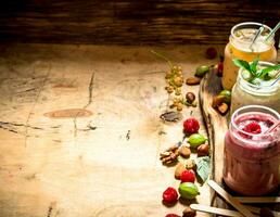 Berry smoothie with wild berries and nuts. photo