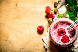 Raspberry smoothie with different berries. photo