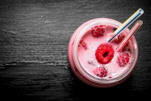 Raspberry smoothie with whole berries. photo